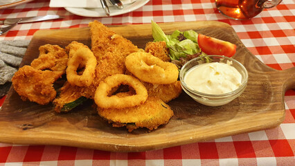Fried food on a wooden plate