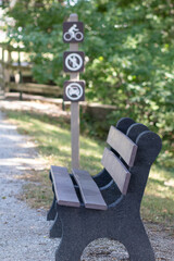 Park bench by cross walk bridge summer walk. High quality photo