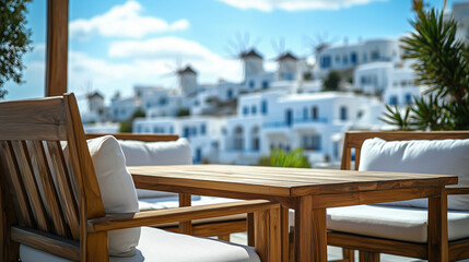 Obraz premium Outdoor dining furniture overlooking the island's white buildings