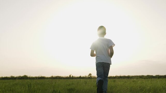 boy son child running airplane game flight dream playground green field sunset pilot, fun flying playtime, child on green field, child sunset plane game, young boy airplane passion, playtime at dusk