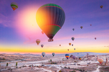 Colorful hot air balloons over Cappadocia, Turkey at sunrise banner with sunlight