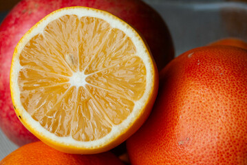Close-up shot of juicy sliced oranges and grapefruit, showcasing vibrant colors and rich textures.