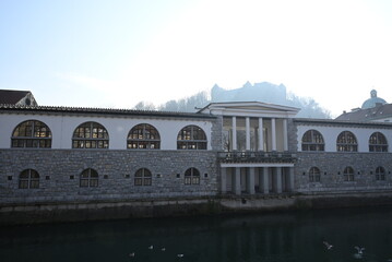 Historic Colonnade and Riverside Scene in a Charming European City on a Sunny Day - Ljubljana