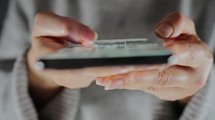 Woman scrolling through social media feeds on smartphone close up - Powered by Adobe