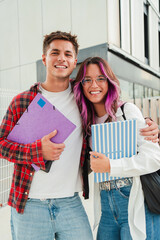 Vertical. Joyful students sharing a moment of friendship and laughter in a university campus , showcasing the essence of youth, education, and camaraderie between high school classmates
