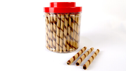 Chocolate wafer rolls Delicious Swirled Waffle Sticks or astor on jar dessert chocolate on White Background isolated transparent