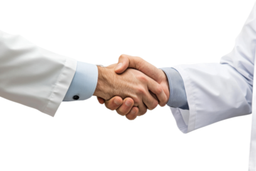 Two professionals shake hands in a medical setting