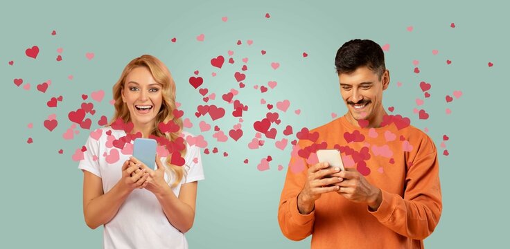 A happy couple interacts with their smartphones, exchanging affectionate messages filled with hearts. They celebrate love on Valentine's Day, surrounded by a playful heart-filled backdrop.