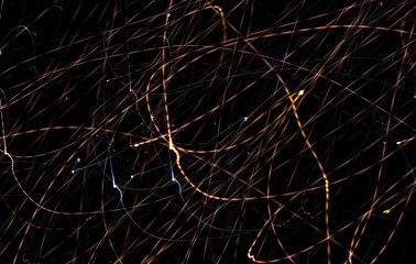 Abstract Background. Camera movement during filming. Light lines on black background. Curves. Dotted lines. Repetition. Laser