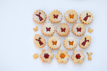 Linzer cookies filled with strawberry and apricot jam, copy space for text. Easter baking