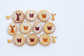 Linzer cookies filled with strawberry and apricot jam, copy space for text. Easter baking