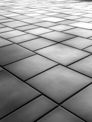 Modern tiled floor design featuring geometric patterns in monochrome shades, ideal for contemporary interiors and architectural projects, flooring concept