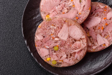 Homemade brawn with salt, spices, herbs and vegetables