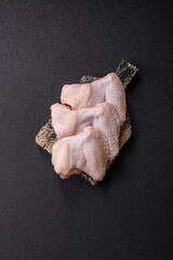 Raw chicken wings with salt, spices and herbs