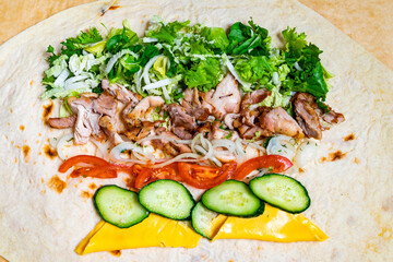 Delicious wrap filled with grilled chicken and fresh vegetables