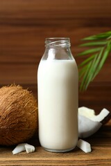 Bottle of milk with coconuts on the table