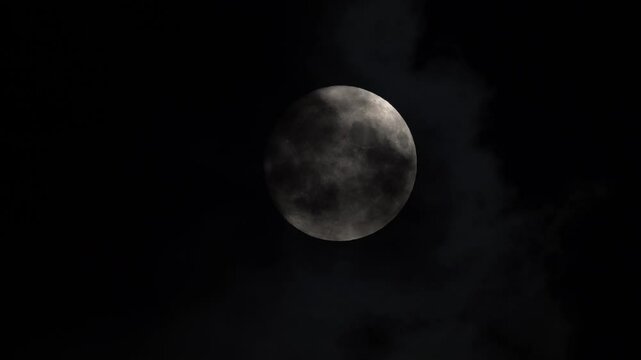 Video of the full moon coming out from behind the cloud