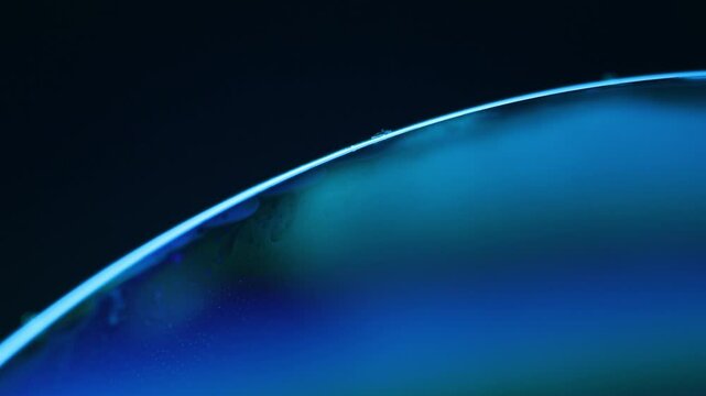 Unique physical phenomenon, freezing water surface, liquid abstraction, blue reflections, movement of crystals on the surface of the liquid