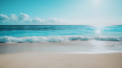 Fototapeta premium Turquoise Ocean Waves on Sandy Beach Under Bright Blue Sky