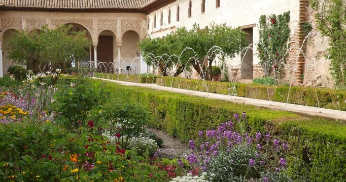 Patio of the Generalife Gardens near Alhambra, Granada. Moorish Water Features and Lush Floral Display
