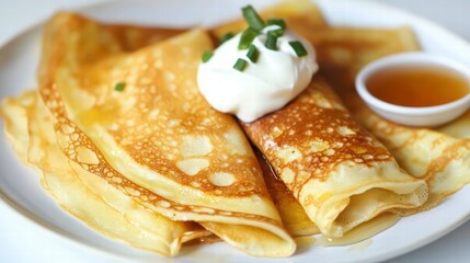 Golden Crepes with Delightful Toppings: A close-up shot reveals delicately golden crepes, artfully arranged on a white plate, topped with a dollop of creamy sauce, a sprinkle of fresh herbs.