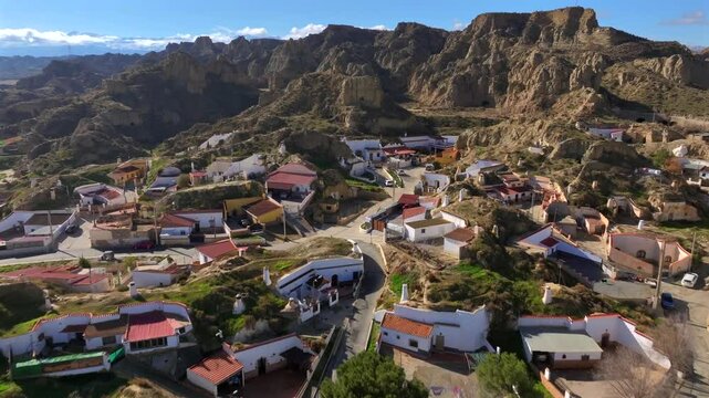 Guadix Cave Houses, Dewlling troglodyte city. Aerial of Prehistoric caves settlement in the mountains of Granada, Spain
