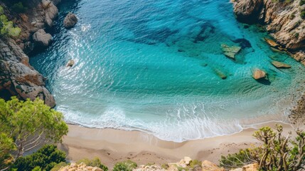 Drone shot of a beautiful tropical beach. The clear blue sea sparkles under the sun, waves gently rolling onto the sandy shore. A perfect scene