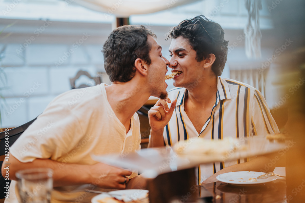 Poster Two young men enjoy a playful and joyful moment while sharing food at a dining table, exuding friendship and happiness.