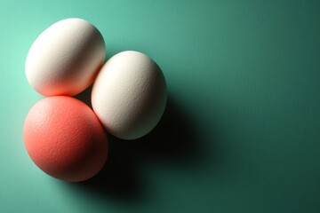 A top-down image showcasing Easter decorations with sparkling confetti and a lineup of multicolored Easter eggs against a teal backdrop, with extra space for text