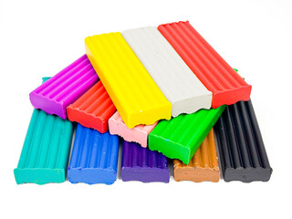 Plasticine on a white background. Children's colorful plasticine bricks. Plasticine of different colors. Plasticine bars. Children plasticine isolated on white.