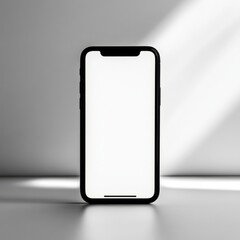 Sleek smartphone with blank screen for mockup, in spotlight against white wall
