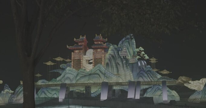 Beijing, China. Ungraded C LOG 2, Large Lantern Composition At Zigong Lantern Festival. Visualization Of Lighting Composition Of Waterfalls, Full Moon And Chinese Pailou Traditional Gates. Pailou