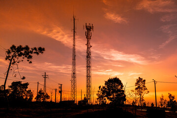 telecommunications antennas and sunset