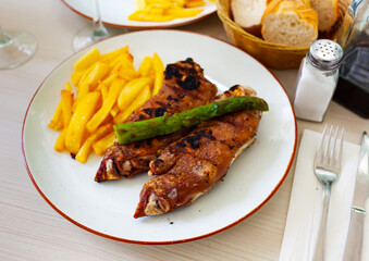 cuisine american roast pigs trotter with asparagus served with parsley on plate on table.