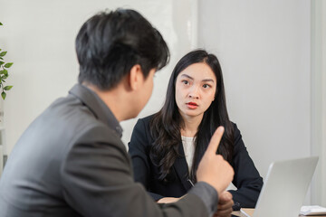 Colleagues analyzing financial data and reports in a collaborative meeting.
