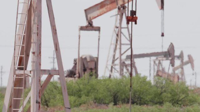 Close Up Pump Jack Line Pumping Oil