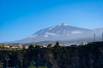 Fototapeta premium Full view on volcano Teide from Playa de San Marcos and Icod de los Vinos, north of Tenerife in January, Canary islands, Spain