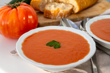 Famous vegetables soup from Cordoba, Andalusia salmorejo served cold in restaurant for lunch as starter dish close up