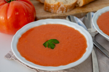 Famous vegetables soup from Cordoba, Andalusia salmorejo served cold in restaurant for lunch as starter dish close up