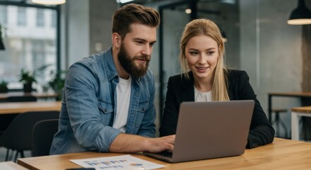 Fototapeta premium Modern Business Professionals Analyzing Data Together in Contemporary Office Space