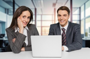 Business people brainstorming strategy together in office