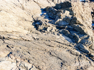 A large gray rock, on the coast of the city of Salvador BA, Brazil