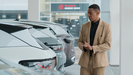 African American business man choosing automobile smiling client customer buyer millennial guy...