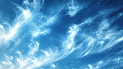 A deep azure sky with high-altitude cirrus clouds stretching in delicate patterns.