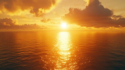 Obraz premium A panoramic view of the sea at sunset, soft golden light casting a glow over the calm water.