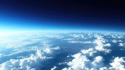 A serene sky filled with soft white clouds, deep blue stretching endlessly into the distance.