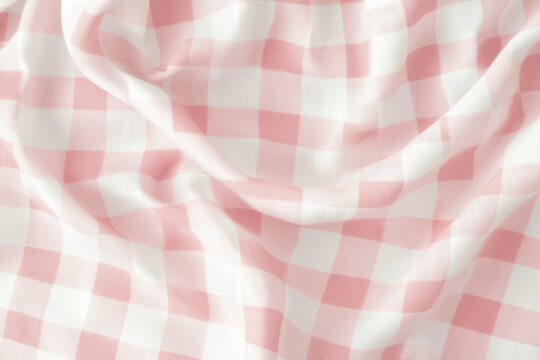 A vintage inspired gingham pattern in soft pastel pink and white, evoking a nostalgic and charming aesthetic.