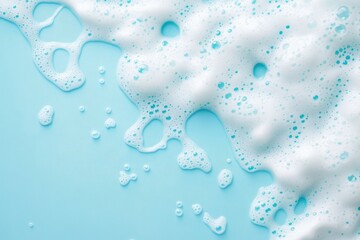 White soap foam and bubbles against a light blue background