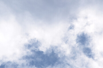 Heavy rain cloud with blue sky as background