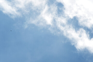 Heavy rain cloud with blue sky as background